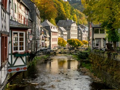 River and cottage houses in Monschau, in Autumn.